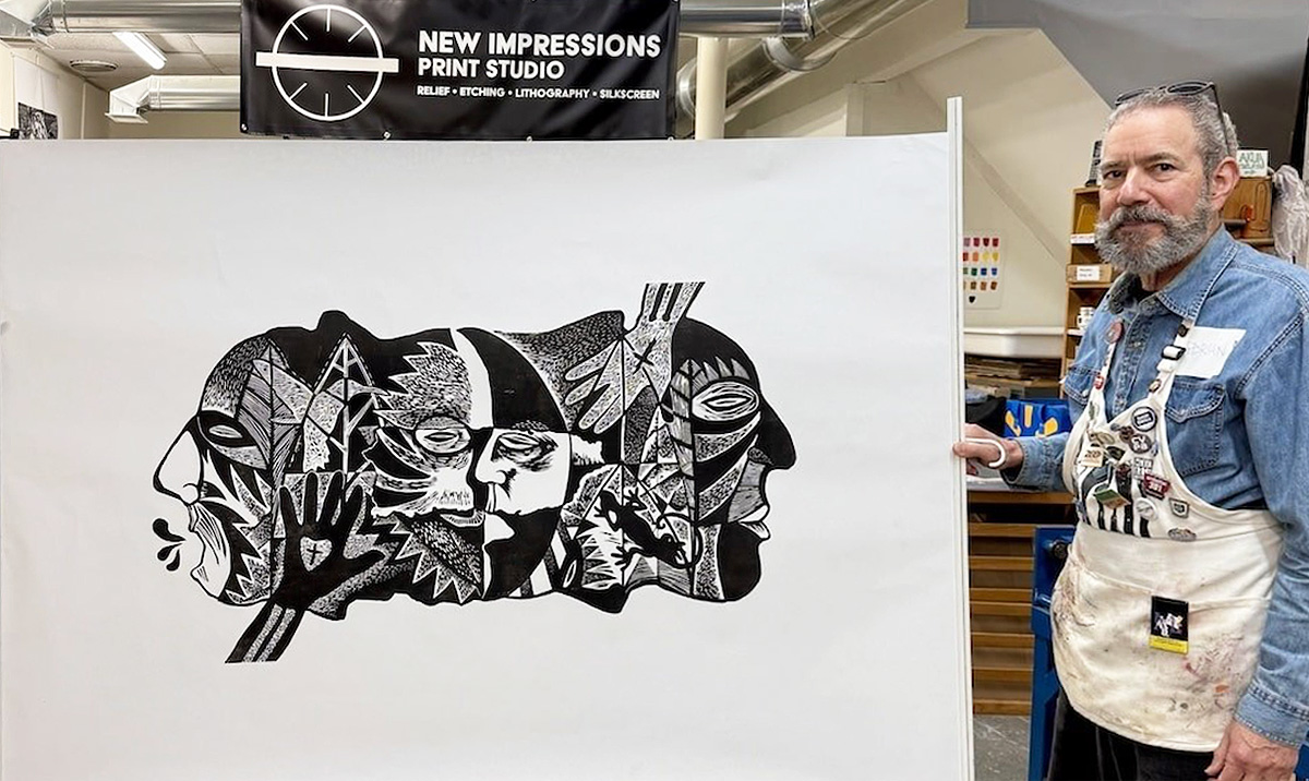 Adrian R Tio at Big Ink Adrian R Tio holding a final print